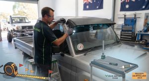 Figure 1: Executing a precise heavy commercial truck sun visor installation ensures your exterior shade canopy stays rigidly aligned, wind-resistant, and completely waterproof across heavy transport routes.