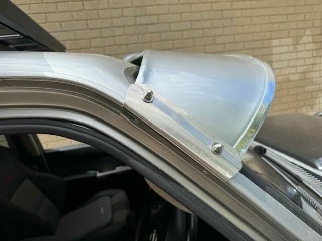 A GU Patrol sun visor mounted across the roofline