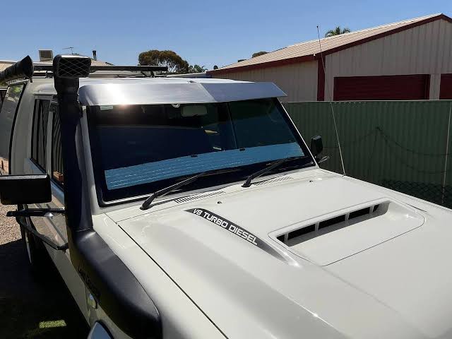 A properly angled sun visor diverts airflow smoothly over the cab roof