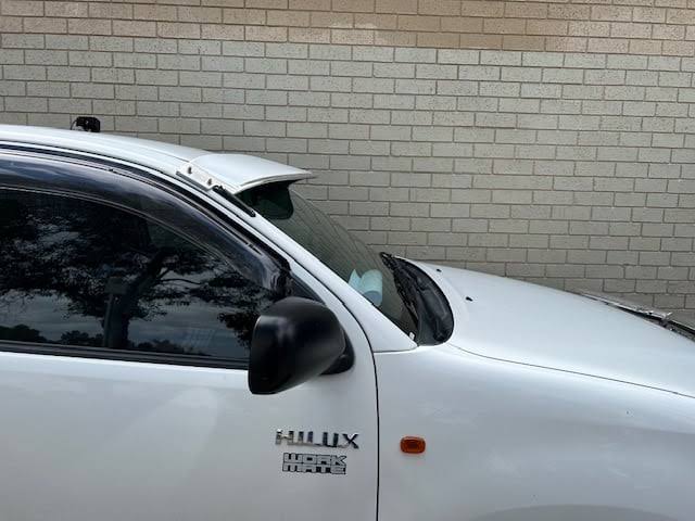 Solid external sun visor mounted to an N70 cab